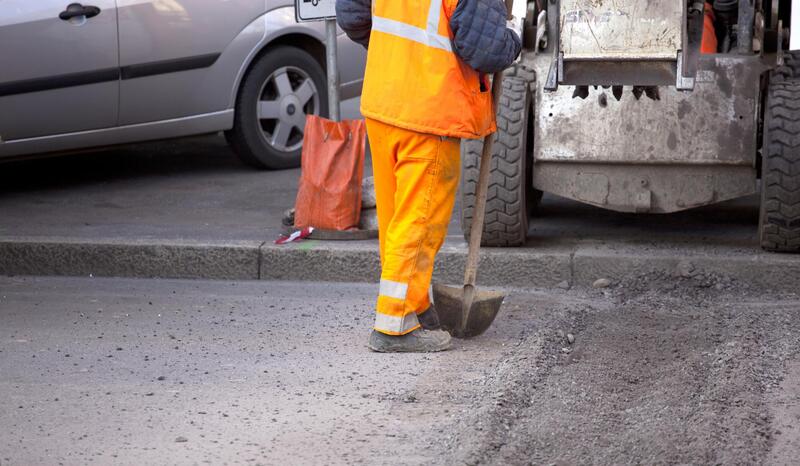worker working paving roads